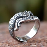 The Viking rune dragon ring worn on a hand, demonstrating its fit and bold presence.