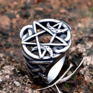 Detailed shot showcasing the five-pointed star (pentagram) at the center of the ring.