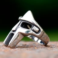 Side profile of the MF Doom mask ring, highlighting its intricate details and robust design.
