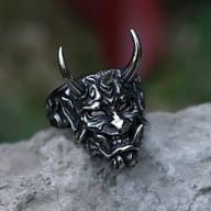 Angled shot of the 316L stainless steel demon skull ring, highlighting the horn and head detail.