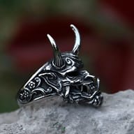 Detailed side view of the 316L stainless steel demon skull ring's intricate facial features and texture.