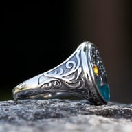 Detailed view of the intricate tree branches on the Viking Tree of Life ring, highlighted against black.