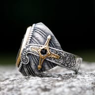 Side profile of the 316L stainless steel Turkish signet ring's intricately textured band with dark background.