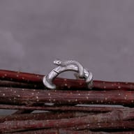 Side profile showing the hinged snap clasp of the snake hoop earring