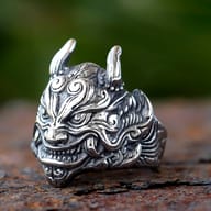 Close-up of the top half of the Oni mask ring, showing horns and forehead details.