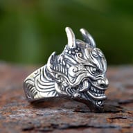 Close-up of the Oni mask ring's face, highlighting the fierce eyes and intricate facial lines.