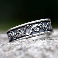 Side angle of the stainless steel ring, showing the raised texture of the Viking-inspired design.