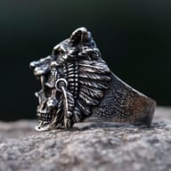 Detailed shot of the 316L stainless steel skull's face on the ring, showing intricate teeth and eye sockets.