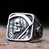 Close-up of a vintage men's 316L stainless steel ring featuring a detailed death sickle skull design on a rustic, textured surface.