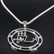 Close-up of the durable stainless steel box chain texture against a dark background
