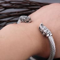 Side angle highlighting the polished twisted steel band and textured dragon terminal