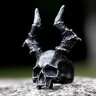 Side profile of the men's gothic skull ring, showcasing the horned design and textured finish