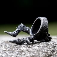 Back view of the men's horned skull ring, displaying its solid stainless steel build and detailing