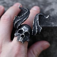 Close-up detail of the blackened antique finish on the demon skull ring face