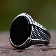 Detailed view of the textured silver-toned band of the totem ring