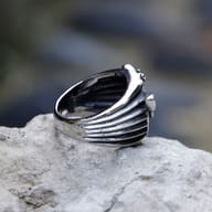 Side profile of the punk-style 316L stainless steel ring with skull moth emblem.