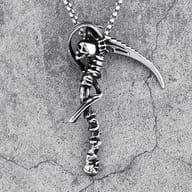 Angle shot of the stainless steel skull scythe pendant, with 'DEATH SCYTHE' text next to the handle.