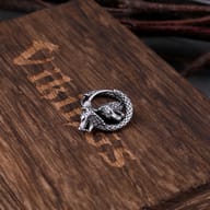 Angled macro view highlighting the blackened detailing of the wolf earring
