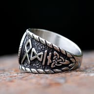 Close-up of the antique oxidized finish and rope border around the runic compass