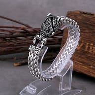 Nordic wolf head 316L stainless steel bracelet displayed on a clear stand