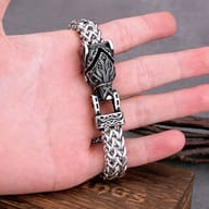 Close-up of the carved wolf head clasp on a stainless steel chain bracelet