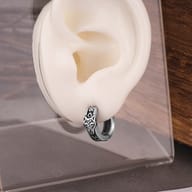 Viking wolf head hoop earring displayed to highlight the compact huggie proportions