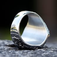 Men's Viking raven signet ring worn on finger showcasing scale and fit