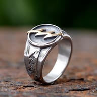 Frontal view of the 316L stainless steel lightning bolt ring featuring a bold gold-plated central design.
