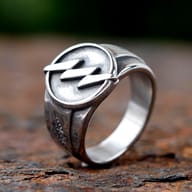 Detailed view of a stainless steel lightning bolt ring, highlighting the metallic finish and lightning symbol.