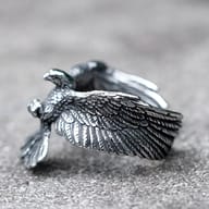 Side profile of flying eagle ring highlighting the sculpted feather texture on the band