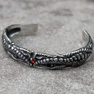 Close-up of the dragon's eye and scale texture on the stainless steel bracelet.