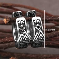 Pair of durable Viking Valknut huggie hoop earrings displayed on a dark background