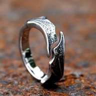 Detailed view of the textured, layered top segment of the 316L stainless steel dragon wing ring.