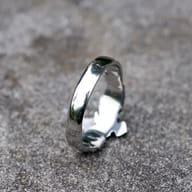 Oblique view of the ring's band and a portion of the eagle motif, showcasing the durable material.