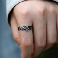 Detailed shot of the Celtic knotwork integrated into the eagle's body on the stainless steel ring.