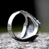Angled close-up of the Norse pattern detailing on the band of the Flying Eagle ring.