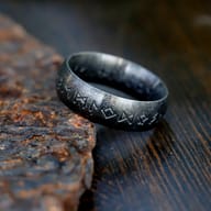 Side angle view of the engraved Elder Futhark rune ring