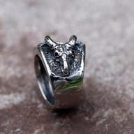 Angled shot highlighting the oxidized finish and pentagram design of the 316L stainless steel men's ring.