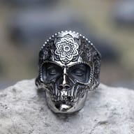 Top-down view focusing on the decorative floral-like pattern etched onto the skull's forehead.