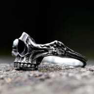Side angle of the punk rock skull ring, highlighting the textured band.