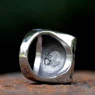 Crown skull playing card ring worn on a hand showing scale and fit
