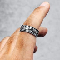 Detailed view of the Phoenix head and wing motif on the 316L stainless steel ring band.