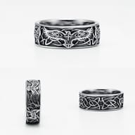 Phoenix Totem ring presented on a neutral background, emphasizing its robust and detailed craftsmanship.