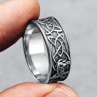 Macro view of the Celtic-inspired knotwork and central cross design on the men's steel ring.