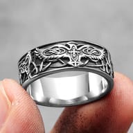 Angled shot highlighting the polished inner band and brushed outer finish of the Phoenix Totem ring.