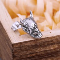 Ear view showcasing the fit and scale of the horned skull stud earring