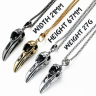 Full length view of the 316L stainless steel gothic raven skull necklace, laid flat.