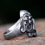 Side view highlighting the textured finish and individual tentacle suckers of the ring.