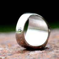 Masonic ring displaying both the symbol face and patterned band detail.