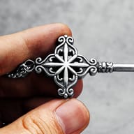 Detailed view of the key's bit and lower shaft of the 316L stainless steel pendant